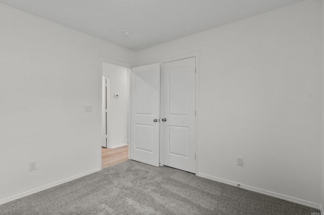 1233 Santa Fe Trl, Bauxite, AR 72011 - unfurnished bedroom featuring carpet flooring and baseboards