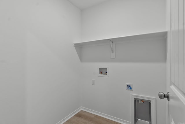 1233 Santa Fe Trl, Bauxite, AR 72011 - laundry room featuring washer hookup, light wood finished floors, baseboards, and electric dryer hookup