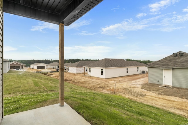 1233 Santa Fe Trl, Bauxite, AR 72011 - view of green lawn featuring a residential view and a patio
