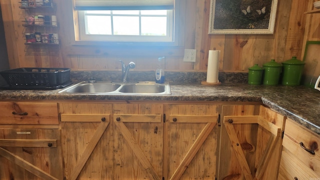 44 Duncan Ln, Story, AR 71970 - kitchen with a sink, dark countertops, and brown cabinets