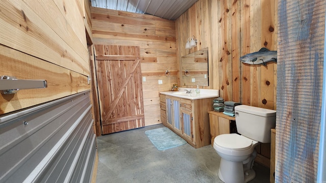 44 Duncan Ln, Story, AR 71970 - bathroom featuring concrete flooring, toilet, vanity, and wood walls