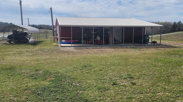 44 Duncan Ln, Story, AR 71970 - view of pole building featuring a lawn and a carport