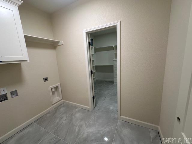 1000 Duke Dr, Bauxite, AR 72011 - washroom featuring electric dryer hookup, baseboards, cabinet space, and hookup for a washing machine
