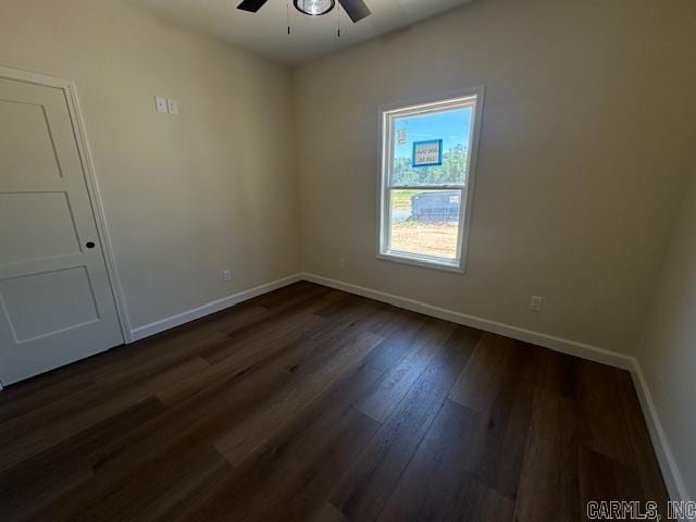 1000 Duke Dr, Bauxite, AR 72011 - unfurnished room featuring ceiling fan, baseboards, and dark wood-type flooring