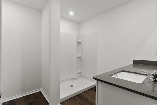11089 River Valley Dr, Hensley, AR 72065 - bathroom featuring wood finished floors, a shower stall, vanity, and recessed lighting