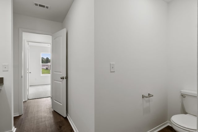11089 River Valley Dr, Hensley, AR 72065 - hall featuring dark wood-type flooring and baseboards