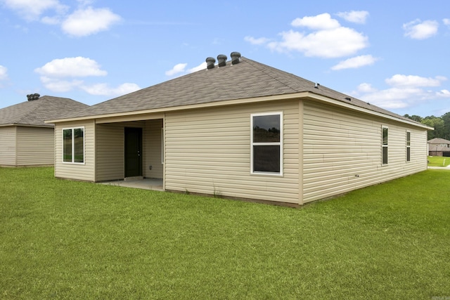 11089 River Valley Dr, Hensley, AR 72065 - back of house featuring a lawn and roof with shingles