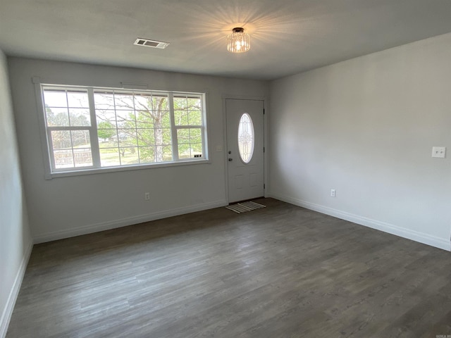117 Circle Dr, Mount Ida, AR 71957 - foyer entrance with dark wood finished floors, baseboards, and visible vents