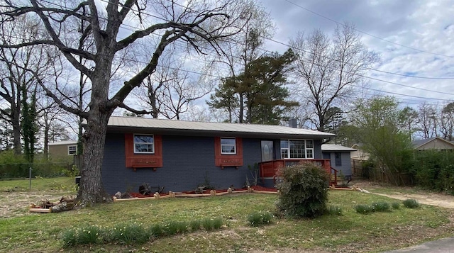 117 Circle Dr, Mount Ida, AR 71957 - single story home featuring fence, metal roof, a deck, a front yard, and brick siding