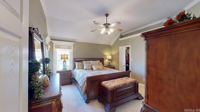 bedroom featuring ornamental molding, lofted ceiling, light colored carpet, and ceiling fan