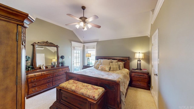 bedroom with a ceiling fan, vaulted ceiling, crown molding, and light colored carpet