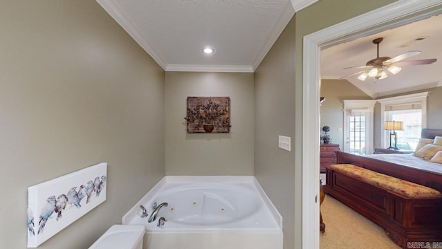bathroom featuring a textured ceiling, crown molding, a tub with jets, a ceiling fan, and vaulted ceiling