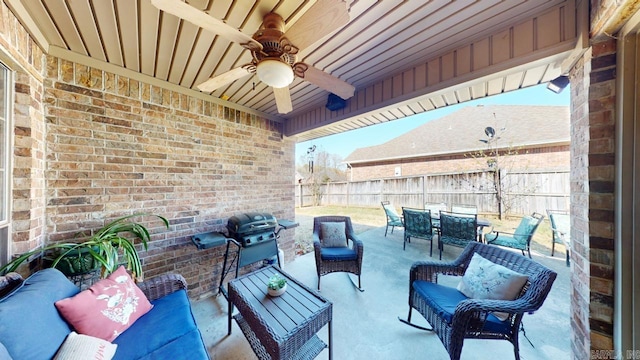 view of patio / terrace featuring area for grilling, outdoor dining area, a fenced backyard, ceiling fan, and outdoor lounge area