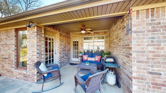 view of patio / terrace with an outdoor living space and ceiling fan