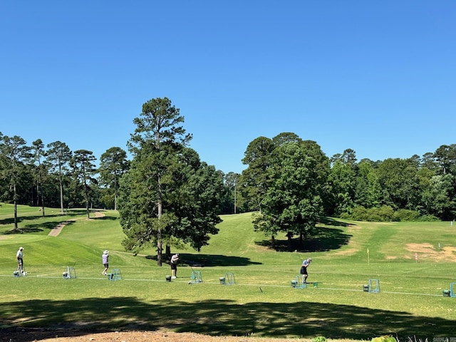 2 Dias Ln, Hot Springs Village, AR 71909 - surrounding community featuring a yard, view of golf course, and view of wooded area