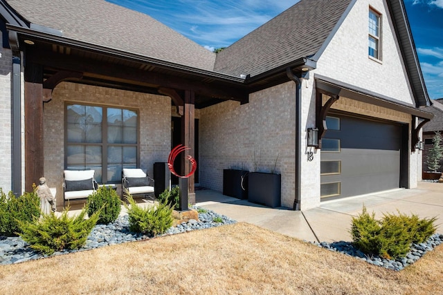 18 Ensbury Pl, Little Rock, AR 72223 - view of front facade with brick siding, driveway, roof with shingles, and an attached garage