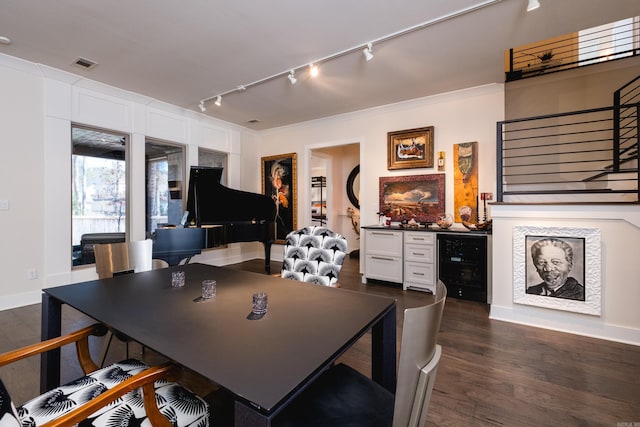 18 Ensbury Pl, Little Rock, AR 72223 - dining room featuring dark wood finished floors, beverage cooler, a dry bar, visible vents, and track lighting