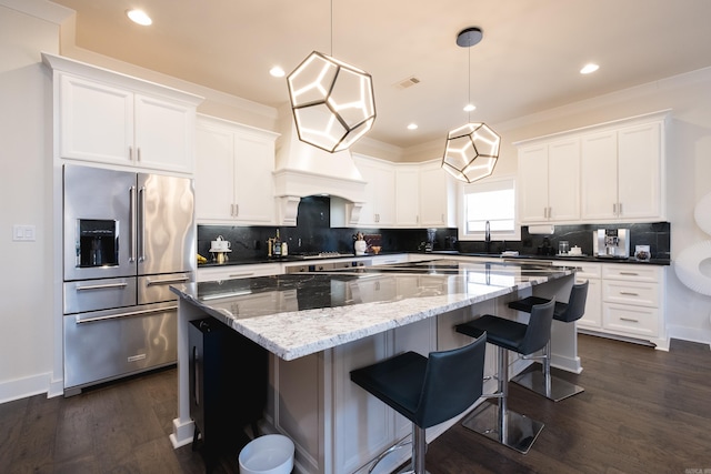 18 Ensbury Pl, Little Rock, AR 72223 - kitchen featuring white cabinetry, visible vents, appliances with stainless steel finishes, and a kitchen island