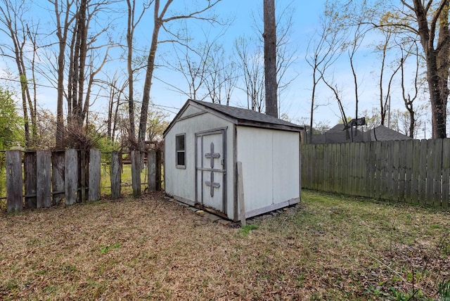 view of shed featuring a fenced backyard