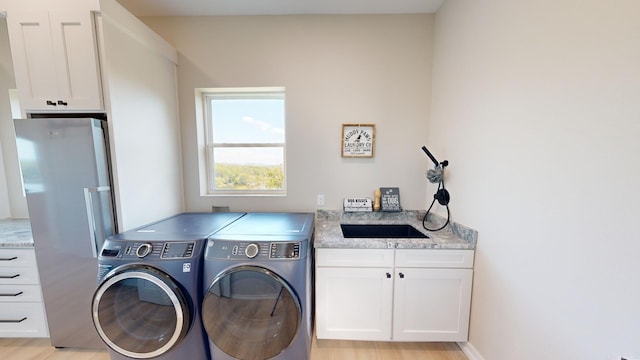 156 Waterfront Dr, Hot Springs, AR 71913 - laundry room with cabinet space, a sink, and separate washer and dryer