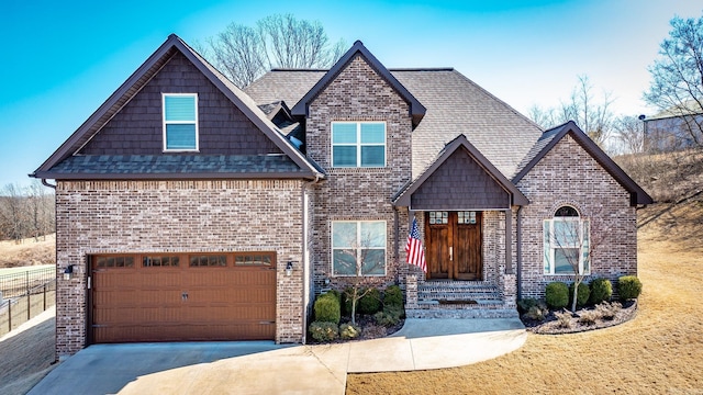 view of front of home featuring driveway, roof with shingles, an attached garage, brick siding, and a front lawn