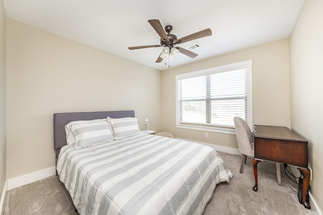 bedroom with baseboards, visible vents, ceiling fan, and carpet