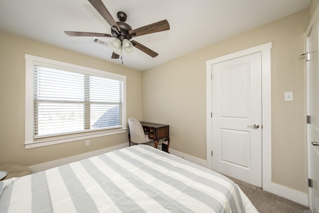 carpeted bedroom with baseboards, visible vents, and a ceiling fan
