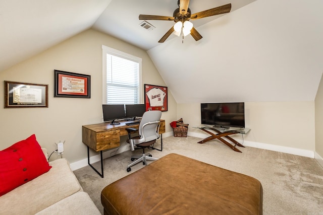 office space featuring baseboards, visible vents, carpet, and vaulted ceiling