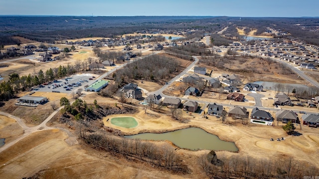 birds eye view of property with a water view and a residential view