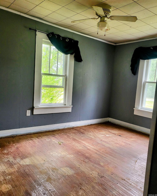 755 Ash St, Prescott, AR 71857 - unfurnished room with baseboards, ornamental molding, a ceiling fan, and wood-type flooring