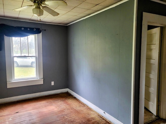 755 Ash St, Prescott, AR 71857 - empty room featuring baseboards, crown molding, wood finished floors, and a ceiling fan