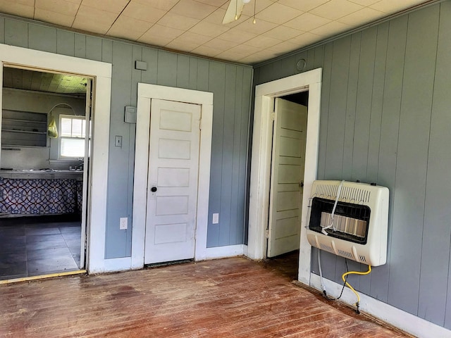 755 Ash St, Prescott, AR 71857 - interior space featuring heating unit, baseboards, and wood finished floors
