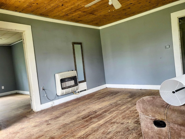 755 Ash St, Prescott, AR 71857 - interior space featuring heating unit, wood finished floors, a ceiling fan, and crown molding