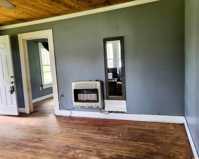 755 Ash St, Prescott, AR 71857 - unfurnished room featuring heating unit, plenty of natural light, wooden ceiling, and ornamental molding