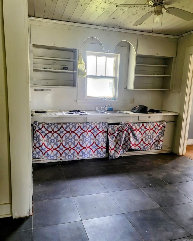 755 Ash St, Prescott, AR 71857 - kitchen featuring dark tile patterned floors, wood ceiling, a sink, and open shelves