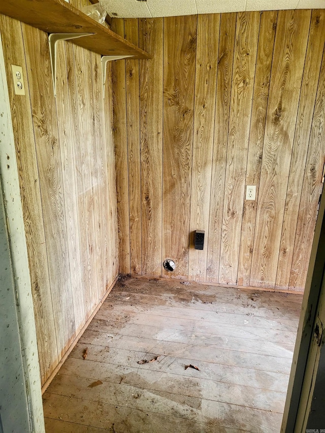 755 Ash St, Prescott, AR 71857 - spare room featuring hardwood / wood-style flooring and wooden walls