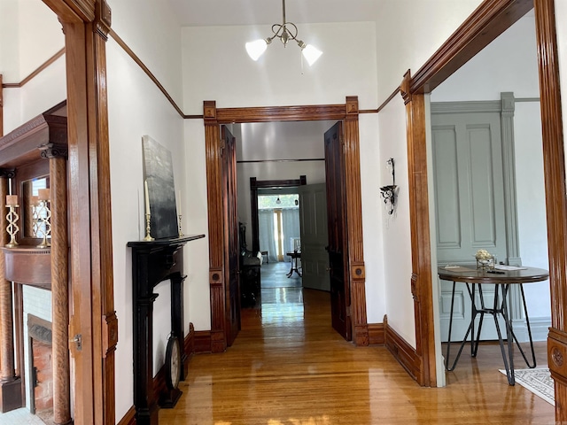 2107 Broadway St, Little Rock, AR 72116 - corridor with baseboards, a towering ceiling, and light wood-style floors