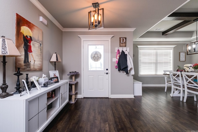entryway featuring dark wood-style floors, a wealth of natural light, visible vents, and a chandelier