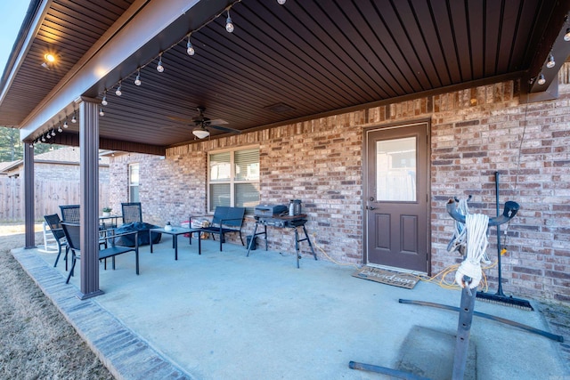 view of patio / terrace featuring a ceiling fan and fence