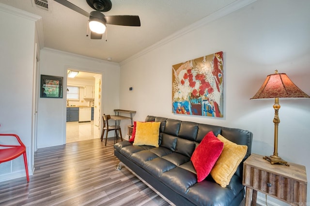 125 Carl Dr, Hot Springs, AR 71913 - living room with visible vents, ceiling fan, wood finished floors, and ornamental molding