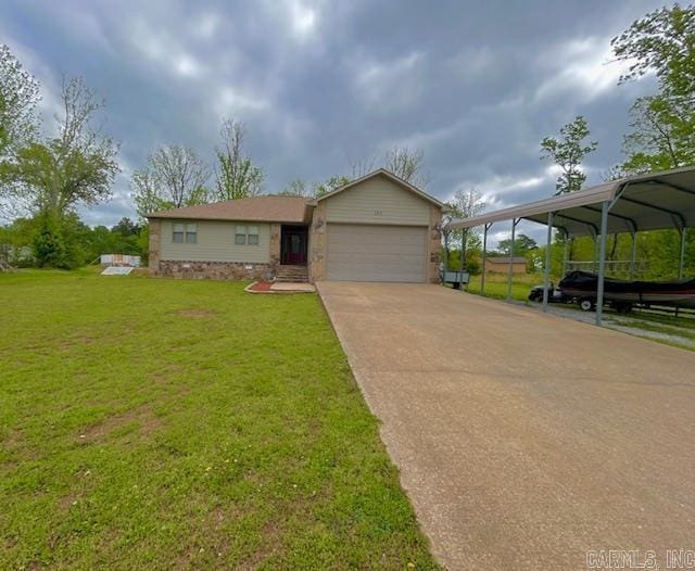 view of front of property with an attached garage, a front lawn, and concrete driveway