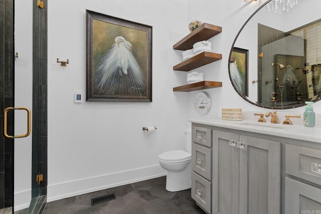 full bath featuring vanity, toilet, baseboards, a shower stall, and visible vents