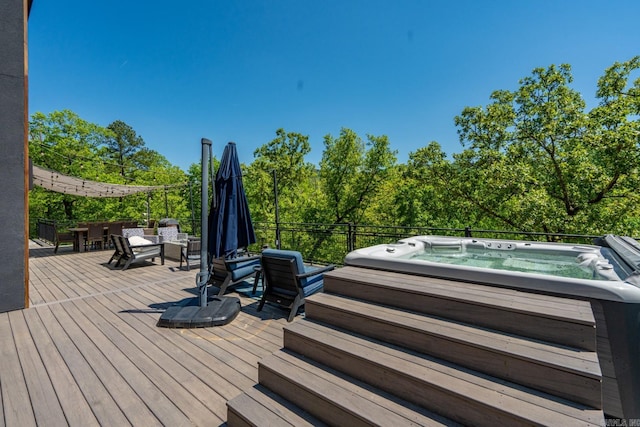 wooden deck with hot tub deck surround