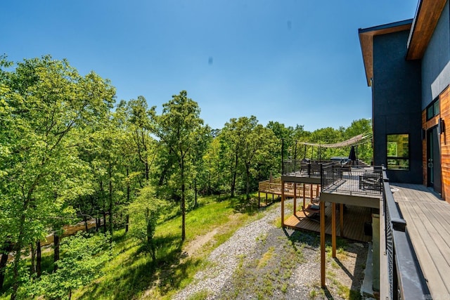 view of yard featuring a wooden deck
