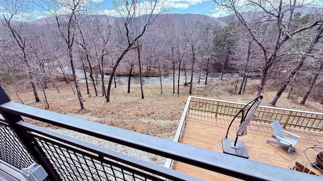 exterior space featuring a water view and a wooded view