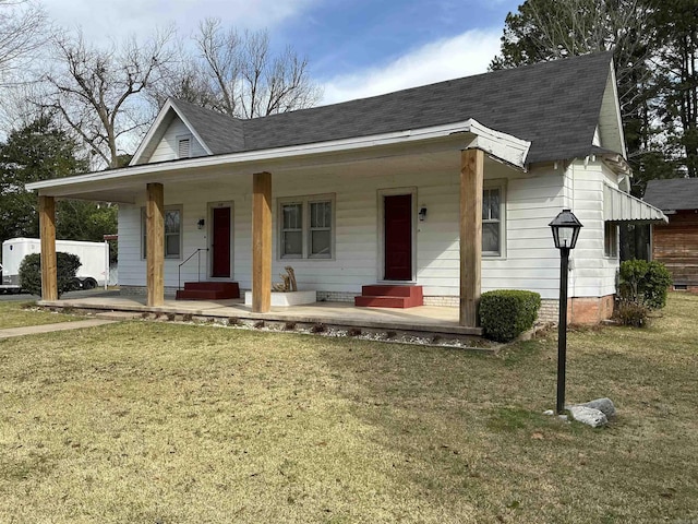 206 W High St, Sheridan, AR 72150 - view of front of house featuring covered porch, a front yard, and a shingled roof