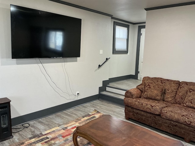 206 W High St, Sheridan, AR 72150 - living room with ornamental molding, wood finished floors, baseboards, and stairs