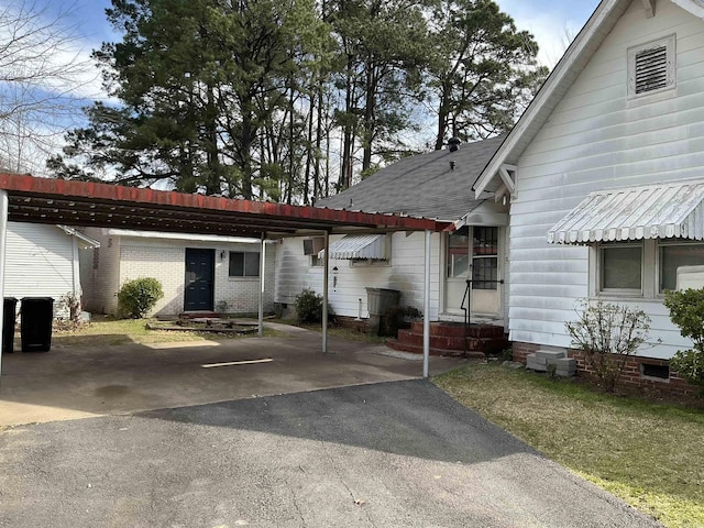 206 W High St, Sheridan, AR 72150 - view of front of home featuring crawl space, entry steps, a shingled roof, and driveway
