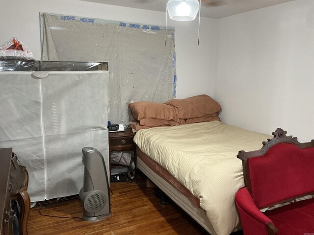 206 W High St, Sheridan, AR 72150 - bedroom featuring wood finished floors