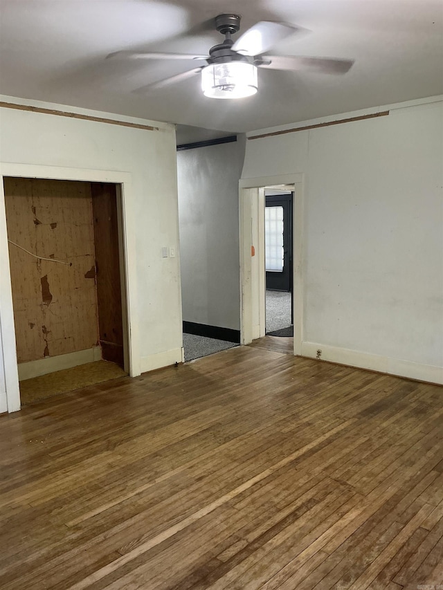 206 W High St, Sheridan, AR 72150 - spare room featuring a ceiling fan, wood finished floors, and baseboards